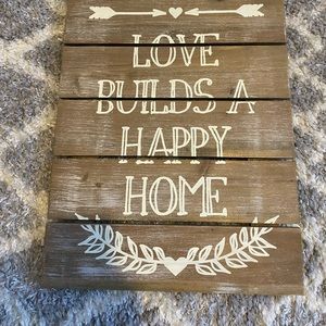 Love builds a happy home wall sign